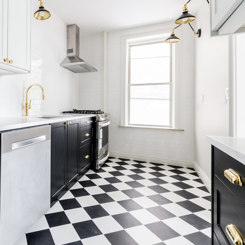 Go for a vintage look in a monochrome galley kitchen with black and white checked floor tiles and metro tiles on the splashback. Buy online and in stores nationwide, Ireland. 